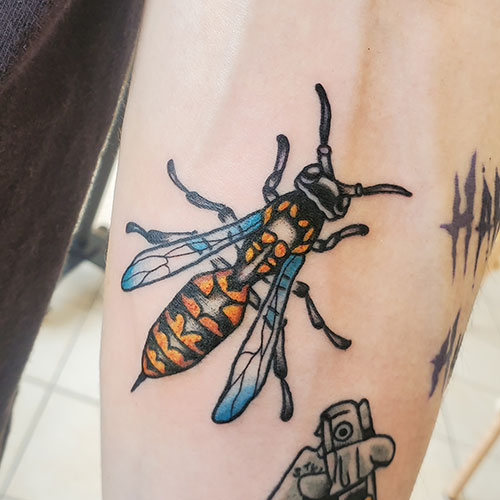 tiny traditional bee tattoo